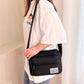 Dámská crossbody taška s více kapsami a zipem